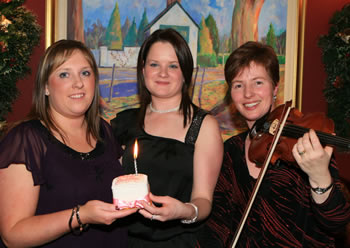Happy birthday to Carolyn Agnew, left, from Laura Ervine during the Blue Cattle Club dinner dance where Heather Montgomery, right, of Ballymoney gave a most moving violin recital. Heather is of course the daughter of pioneering Blue breeders Jack and Anne Morrison.